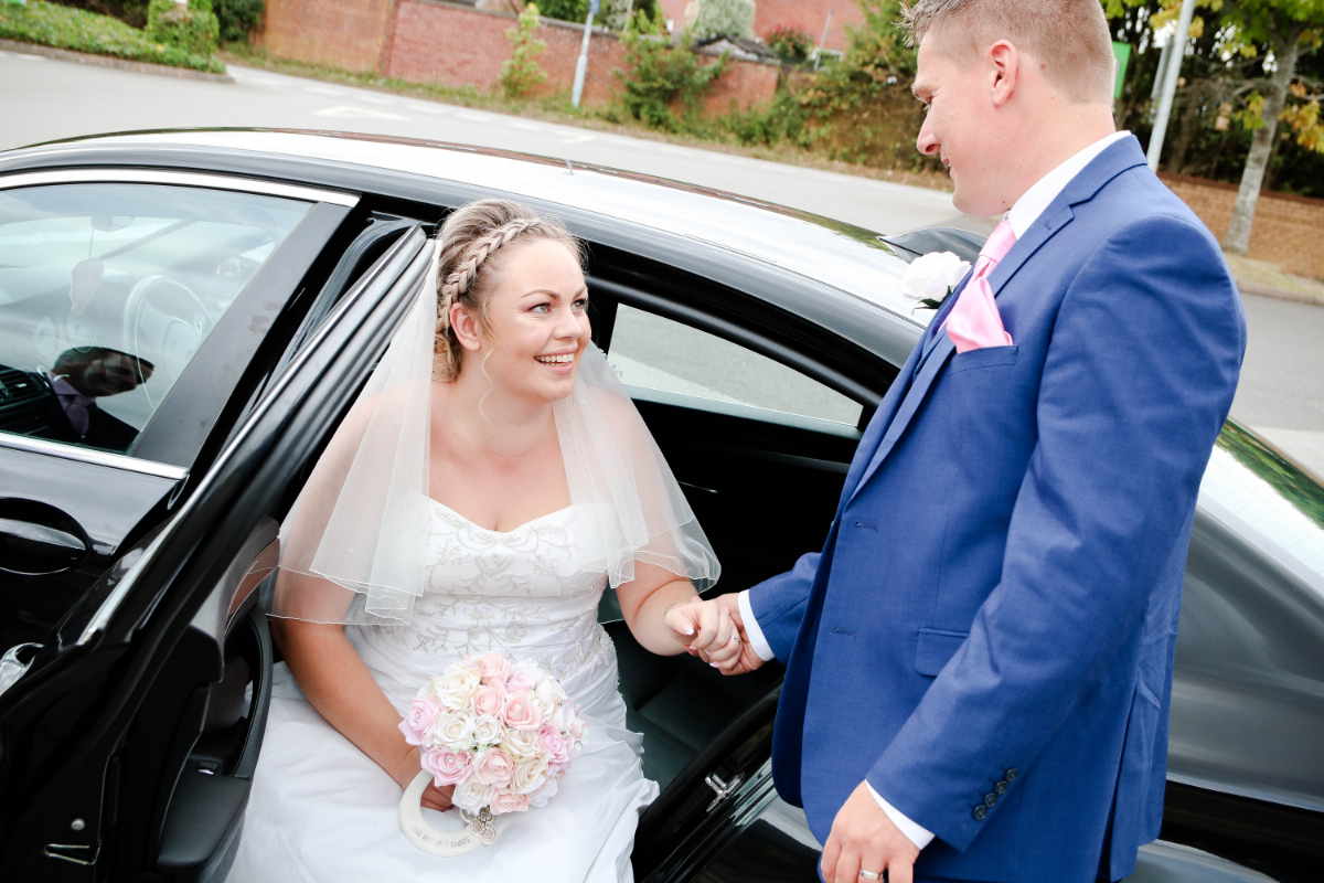 Bride sat in car.